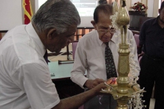 Chancellor Dr. P. R. Anthonis lighting the Traditional Oil Lamp to mark the establishment of the University of Colombo School of Computing UCSC on 1st September 2002.