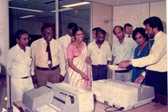 Nayeni Fernando demonstrating the cheque encoders to senior Central Bank staff