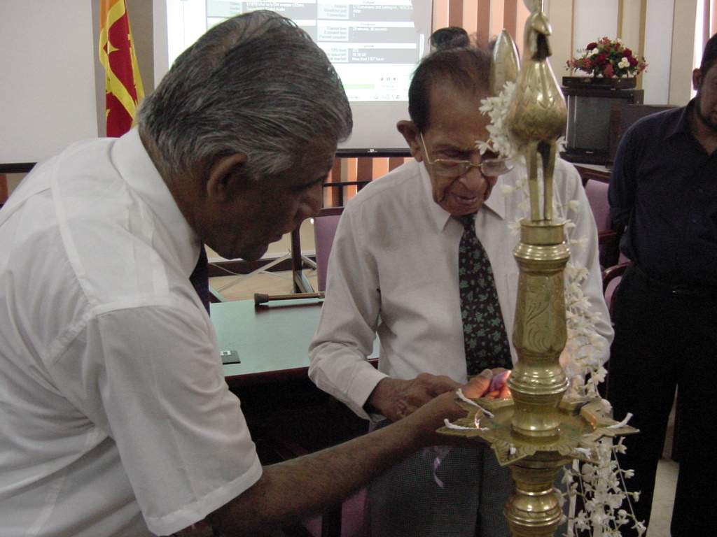 Chancellor Dr. P. R. Anthonis lighting the Traditional Oil Lamp to mark the establishment of the University of Colombo School of Computing UCSC on 1st September 2002.