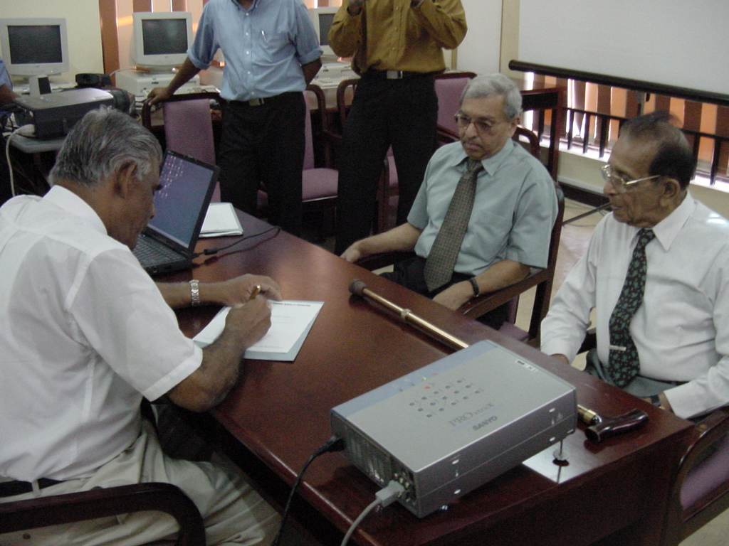 Prof. Samaranayake signing letter of acceptance as new Director, UCSC.