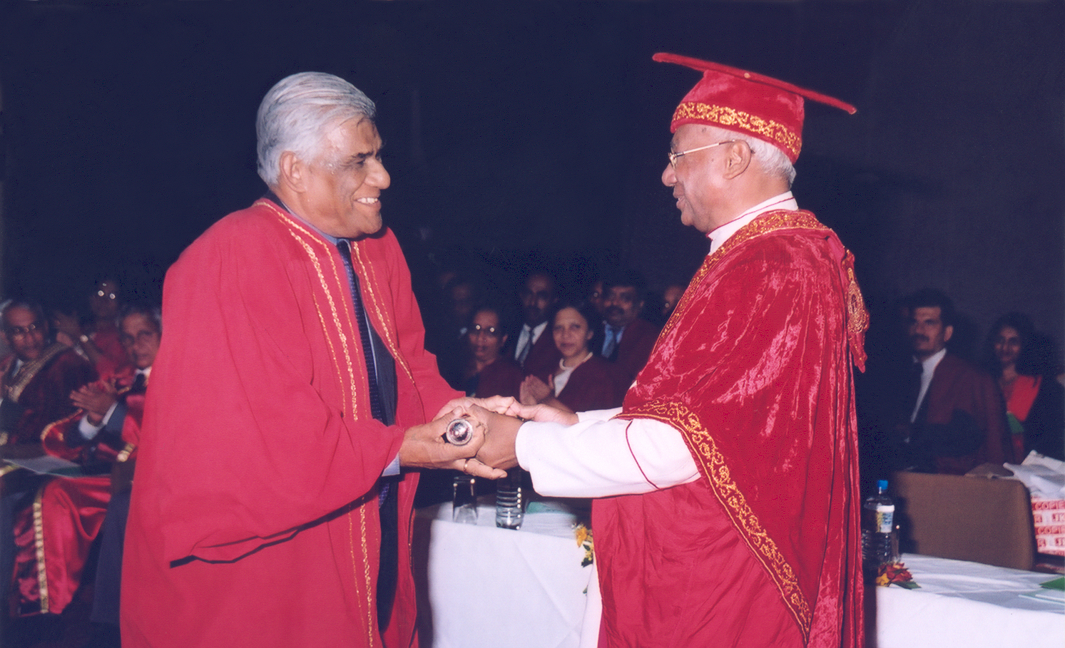 Prof. Samaranayake receiving the degree of D.Sc. ( Honoris Causa ) from Most Rev Bishop Oswald Gomis, Chacellor of the University of Colombo at the 2004 convocation held in January 2005