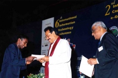 Hon Mahinda Rajapaksa Prime Minister as Chief Guest at the Joint IITC2004 and ICEG2004 awarding certificates of recognition to the IOI team that did extremely well by winning 1 Gold and 3 Bronze medals.