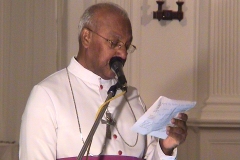 His Grace Bishop Oswald Gomis, Chancellor of the University of Colombo reading the decision of the Council of the University of Colombo to name the UCSC Auditorium as the Prof. V. K. Samaranayake Auditorium at the Felicitation to Prof. Samaranayake held in December